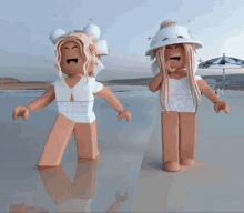 two dolls are standing next to each other on a beach and one is wearing a white hat