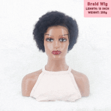 a braided wig is sitting on a mannequin