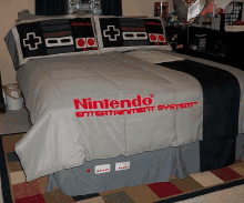 a bed with a nintendo entertainment system comforter on it