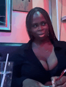 a woman sitting at a table with a glass of water