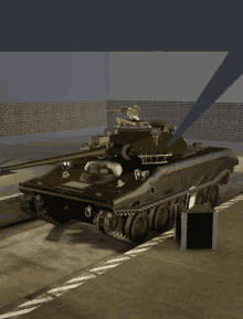 a tank is parked in a parking lot with a brick wall behind it