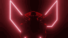 a silhouette of a robot with glowing red lights behind him