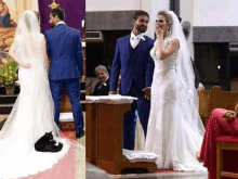 a bride and groom are standing in a church with a black cat sitting on the bride 's dress