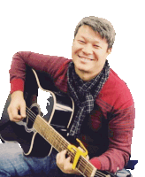 a man in a red sweater is holding a black guitar