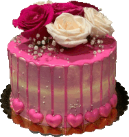 a cake with pink frosting and pink hearts on it