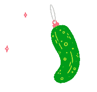 a green pickle ornament is hanging from a string on a string