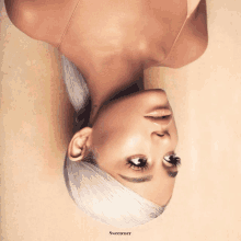 ariana grande 's sweetener album cover features a woman laying upside down