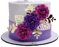 a purple and white cake with purple roses and gold leaves on it