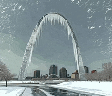 the gateway arch is covered with icicles and snow