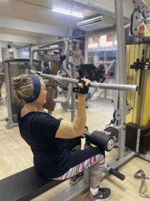 a woman is using a machine that says one on the side