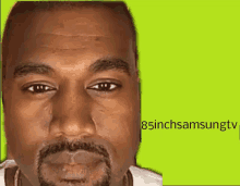 a close up of kanye west 's face with a green background