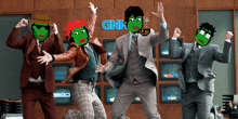 a group of men in suits are dancing in front of a sign that says gnk