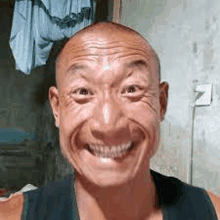 a close up of a man making a funny face .