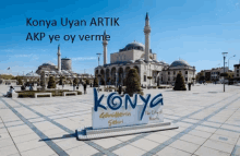 a sign in front of a mosque that says konya