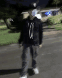 a blurry picture of a person wearing a mask and a cowboy hat