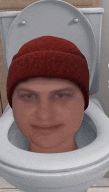 a man wearing a red beanie sits on a toilet