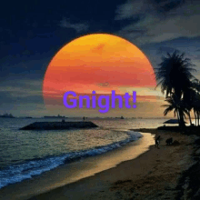 a sunset over a beach with the words `` gnight '' written on it .