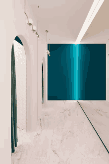 a hallway with a blue wall and a mirror