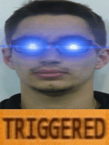 a picture of a man with glowing eyes and the word triggered on the bottom