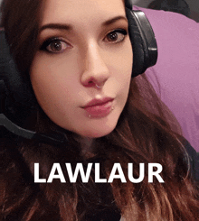 a woman wearing headphones has the word lawlaur on the bottom