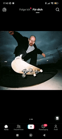 a man is riding a skateboard in front of a live stream