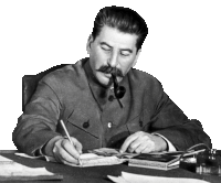 a man sitting at a desk with a pipe in his mouth