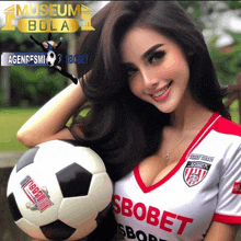 a woman is holding a soccer ball with the word sbobet on it