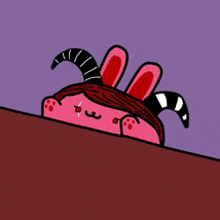 a cartoon character wearing a bunny hat and horns is peeking over a table .