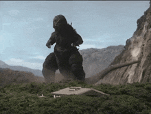 a large monster is standing on top of a building