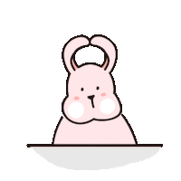 a pink bunny rabbit is sitting on a table with its ears up and looking at the camera .