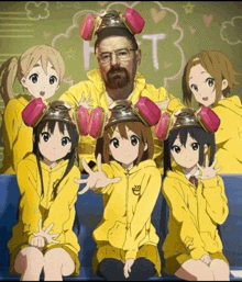 a group of anime girls are posing for a picture with a man wearing a breaking bad hat