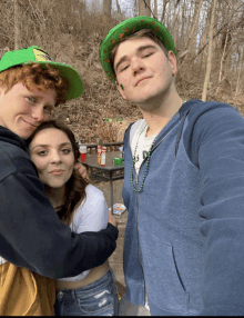 a group of people posing for a picture with one wearing a green hat that says ' irish ' on it