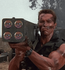 arnold schwarzenegger is holding a rocket launcher with four faces on it