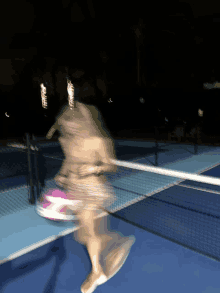 a blurry picture of a person playing tennis