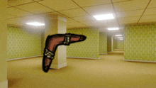 an empty hallway with a drawing of a boomerang on the floor