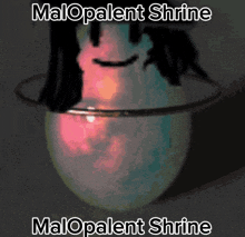 a picture of a glowing object with the words malopatent shrine below it