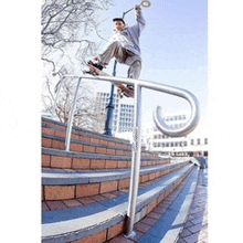 a man is riding a skateboard on a railing