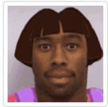 a man wearing a purple shirt and a dora the explorer wig .