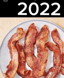 a plate of bacon with the year 2022 written on it