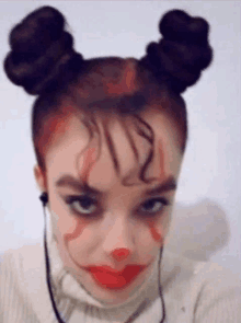 a woman is wearing a clown costume and taking a selfie with headphones .