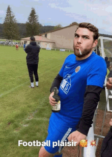 a man smoking a cigarette while holding a bottle of beer with the words football plaisir written below him