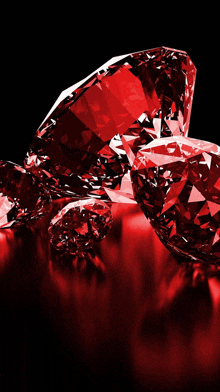 a bunch of red diamonds are on a black background