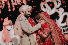 a bride and groom are posing for a picture at their wedding ceremony