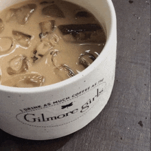 a mug that says i drink as much coffee as the gilmore girls on it