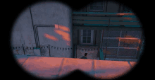 a man in a blue shirt is standing on a balcony in a video game