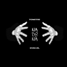 a black and white photo of a person 's hands with the words na de na written on it