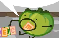 a green tomato with a speech bubble and abc blocks in front of it