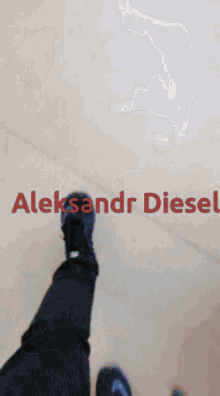 a blurry picture of a desk with the name aleksandr diesel written on it