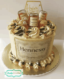 a cake with a bottle of hennessy on top