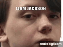 a close up of a person 's face with the name liam jackson on it .